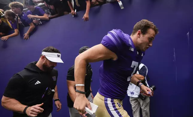 Washington quarterback Will Rogers jogs off the field after a 30-9 win over Eastern Michigan in an NCAA college football game Saturday, Sept. 7, 2024, in Seattle. (AP Photo/Lindsey Wasson)