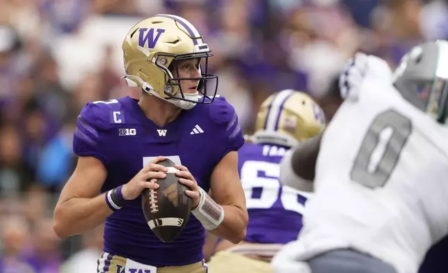 Washington quarterback Will Rogers looks to throw during the first half of an NCAA college football game against Eastern Michigan, Saturday, Sept. 7, 2024, in Seattle. (AP Photo/Lindsey Wasson)