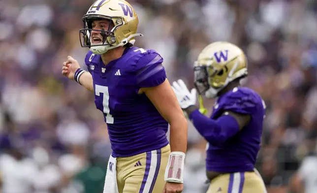 Washington quarterback Will Rogers (7) reacts during the first half of an NCAA college football game against Eastern Michigan, Saturday, Sept. 7, 2024, in Seattle. (AP Photo/Lindsey Wasson)