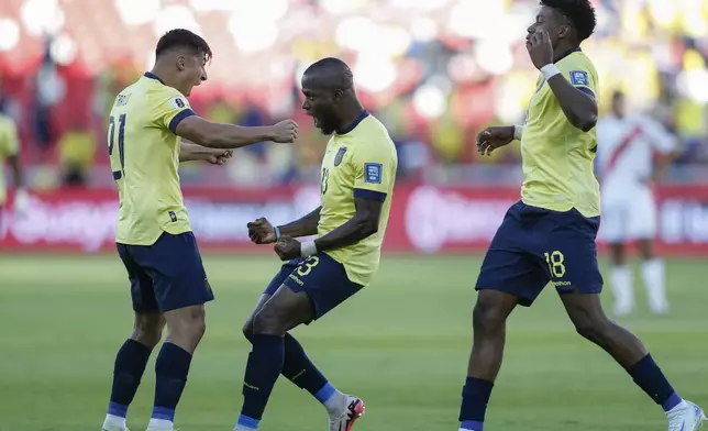 Ecuador's Enner Valencia, center, celebrates with his teammates Alan Franco, left, and John Mercado, scoring his side's opening goal against Peru during a qualifying soccer match for the FIFA World Cup 2026 at Rodrigo Paz Delgado stadium in Quito, Ecuador, Tuesday, Sept. 10, 2024. (AP Photo/Patricio Teran)