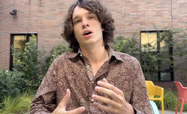 This image taken from video, Brown University student and member of the Brown Divest Coalition, Rafi Ash, speaks to a reporter from The Associated Press, Tuesday, Sept. 3, 2024, in Providence, R.I. (AP Photos/Michael Casey)