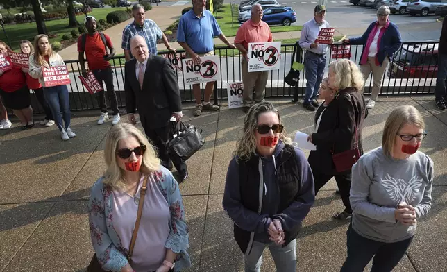 Abortion opponents stand outside the Missouri Supreme Court in Jefferson City, Mo., on Tuesday, Sept. 10, 2024, after the court heard arguments over whether an abortion-rights amendment should go before voters this year. (Robert Cohen/St. Louis Post-Dispatch via AP)