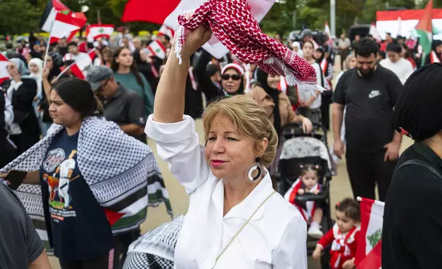 Andrea Awada-Zeaiter of Dearborn attends a rally in support of Lebanon in light of recent Israeli strikes that killed hundreds, on Wednesday, Sept. 25, 2024 in front of the Henry Ford Centennial Library in Dearborn, Mich. (Katy Kildee/Detroit News via AP)