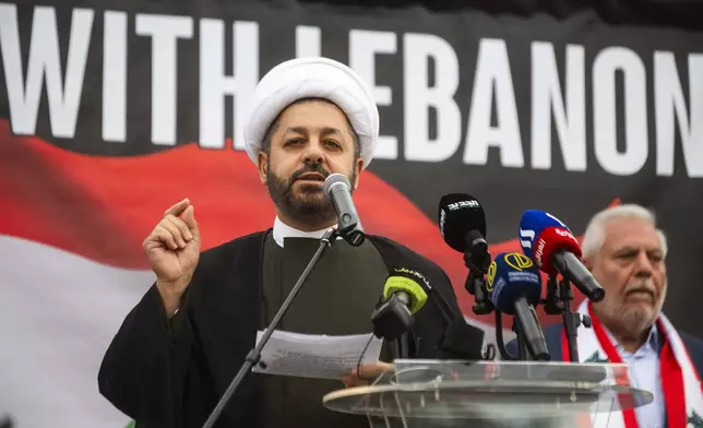 Dr. Baqir Berry of the Islamic Institute of Knowledge speaks to hundreds who gathered for a rally in support of Lebanon in light of recent Israeli strikes that killed hundreds, on Wednesday, Sept. 25, 2024 in front of the Henry Ford Centennial Library in Dearborn, Mich. (Katy Kildee/Detroit News via AP)