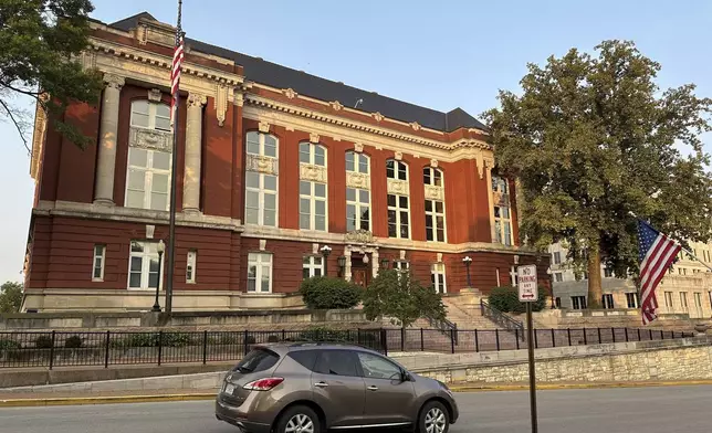 A vehicle passes in front of the Missouri Supreme Court building on Tuesday, Sept. 10, 2024, in Jefferson City, Mo., in advance of oral arguments on whether an abortion rights constitutional amendment should be removed from the general election ballot. (AP Photo/David A. Lieb)