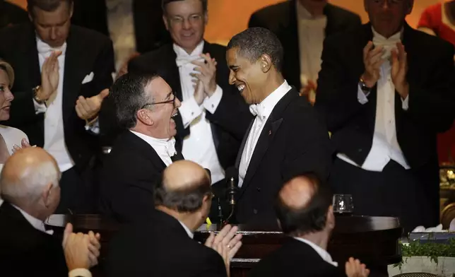 FILE - Democratic presidential candidate Sen. Barack Obama, D-Ill., shakes hands with Al Smith as he prepares to speak during the Alfred E. Smith Dinner at the Waldorf Astoria Hotel in New York on Oct. 16, 2008. (AP Photo/Carolyn Kaster, File)