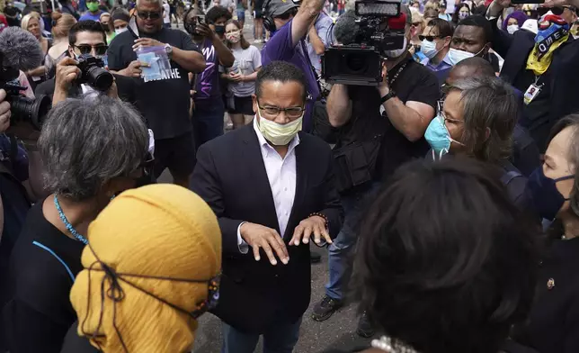 FILE - Minnesota Attorney General Keith Ellison, center, speaks with Rep. Ilhan Omar, D-Minn., and members of the Congressional Black Caucus as they visit the site of George Floyd's death in south Minneapolis on June 4, 2020. (Anthony Souffle/Star Tribune via AP, File)