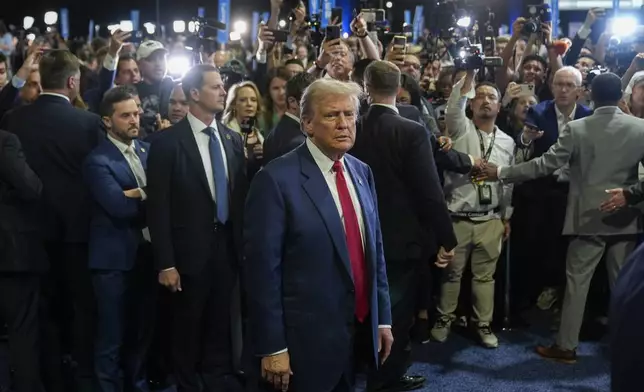 Republican presidential nominee former President Donald Trump arrives to begin speaking to reporters in the spin room after a presidential debate with Democratic presidential nominee Vice President Kamala Harris, Tuesday, Sept. 10, 2024, in Philadelphia. (AP Photo/Pablo Martinez Monsivais)