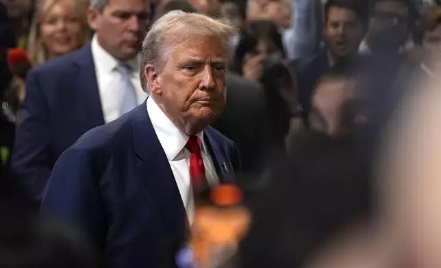 Republican presidential nominee former President Donald Trump speaks to reporters in the spin room after a presidential debate with Democratic presidential nominee Vice President Kamala Harris, Tuesday, Sept. 10, 2024, in Philadelphia. (AP Photo/Matt Slocum)