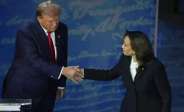 Republican presidential nominee former President Donald Trump shakes hands with Democratic presidential nominee Vice President Kamala Harris during an ABC News presidential debate at the National Constitution Center, Tuesday, Sept.10, 2024, in Philadelphia. (AP Photo/Alex Brandon)