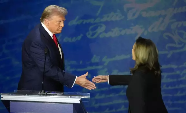 Republican presidential nominee former President Donald Trump shakes hands with Democratic presidential nominee Vice President Kamala Harris during an ABC News presidential debate at the National Constitution Center, Tuesday, Sept.10, 2024, in Philadelphia. (AP Photo/Alex Brandon)