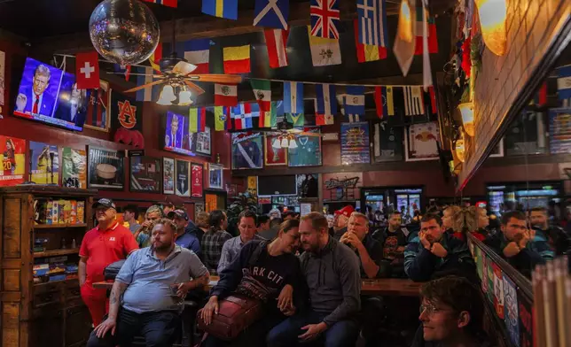 San Francisco Republican party members watch a presidential debate between Democratic presidential nominee Vice President Kamala Harris and Republican presidential nominee former President Donald Trump at Mad Dog In The Fog on Tuesday, Sept. 10, 2024, in San Francisco. (AP Photo/Juliana Yamada)