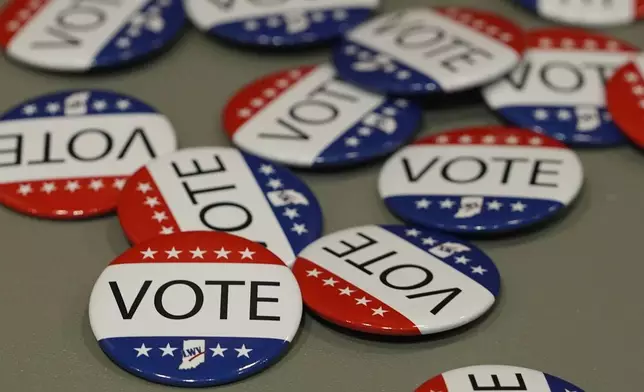 Vote buttons are displayed during a presidential debate between Democratic presidential nominee Vice President Kamala Harris and Republican presidential nominee former President Donald Trump, Tuesday, Sept. 10, 2024, in Muncie, Ind. (AP Photo/Darron Cummings)