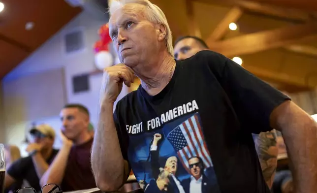 Douglas Frageorgia watches the presidential debate between Republican presidential nominee former President Donald Trump and Democratic presidential nominee Vice President Kamala Harris at Dan's Place, Tuesday, Sept. 10, 2024, in West Greenwich, R.I. (AP Photo/David Goldman)