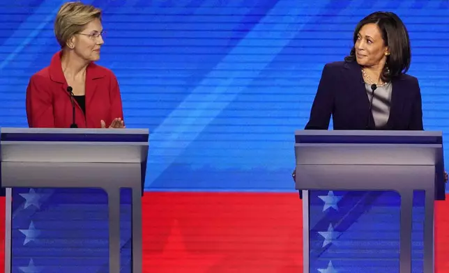 FILE - Democratic presidential candidate Sen. Elizabeth Warren, D-Mass., left and Sen. Kamala Harris, D-Calif., react, Sept. 12, 2019, during a Democratic presidential primary debate in Houston. (AP Photo/David J. Phillip, File)