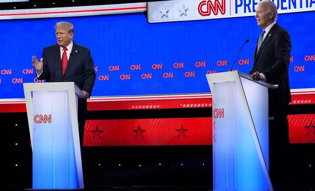 FILE - President Joe Biden, right, and Republican presidential candidate former President Donald Trump, left, during a presidential debate June 27, 2024, in Atlanta. (AP Photo/Gerald Herbert, File)