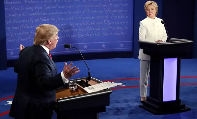 FILE - Democratic presidential nominee Hillary Clinton and Republican presidential nominee Donald Trump debate during the third presidential debate, Oct. 19, 2016. (Mark Ralston/Pool via AP, File)