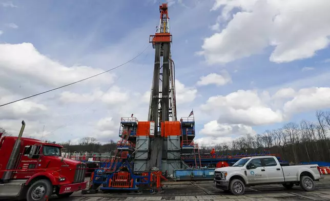 FILE - Work continues at a shale gas well drilling site in St. Mary's, Pa., March 12, 2020. (AP Photo/Keith Srakocic, File)