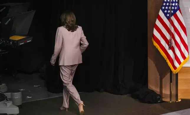 Democratic presidential nominee Vice President Kamala Harris Vice walks off stage after finishing her interview with members of the National Association of Black Journalists at the WHYY studio in Philadelphia, Tuesday, Sept. 17, 2024. (AP Photo/Jacquelyn Martin)