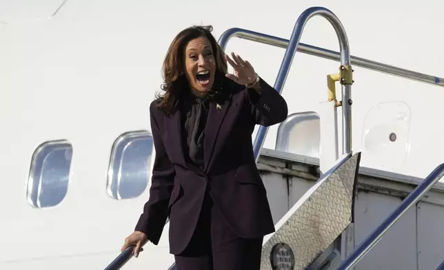 Democratic presidential nominee Vice President Kamala Harris arrives at Detroit Metropolitan Airport in Romulus, Mich., enroute to join Oprah Winfrey at Oprah's Unite for America Live Streaming event Thursday, Sept. 19, 2024. (AP Photo/Paul Sancya)