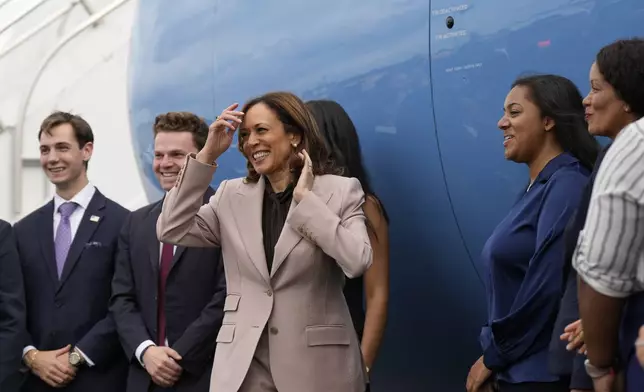 Democratic presidential nominee Vice President Kamala Harris meets with staff on the tarmac before boarding Air Force Two, Monday, Sept. 9, 2024, near Philadelphia International Airport, in Philadelphia, Tuesday, Sept. 17, 2024. (AP Photo/Jacquelyn Martin)