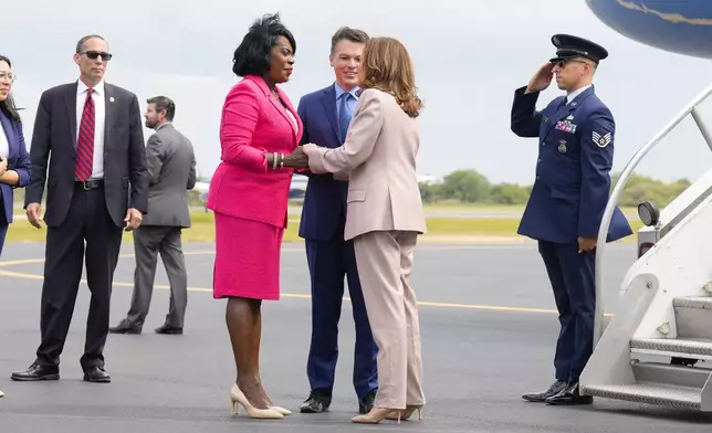 Democratic presidential nominee Vice President Kamala Harris is greeted by Philadelphia Mayor Cherelle Lesley Parker, left, and Rep. Brendan Boyle, D-PA., center, on the tarmac at Atlantic Aviation Philadelphia, Monday, Sept. 9, 2024, near Philadelphia International Airport, in Philadelphia, Tuesday, Sept. 17, 2024. (AP Photo/Jacquelyn Martin)