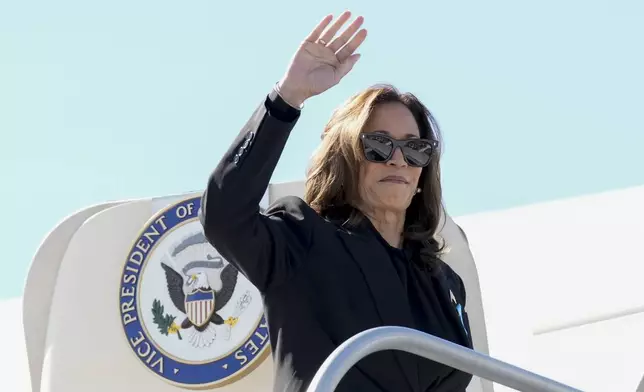 Democratic presidential nominee Vice President Kamala Harris boards Air Force Two at LaGuardia Airport in East Elmhurst, N.Y., Wednesday, Sept. 11, 2024. (AP Photo/Jacquelyn Martin)