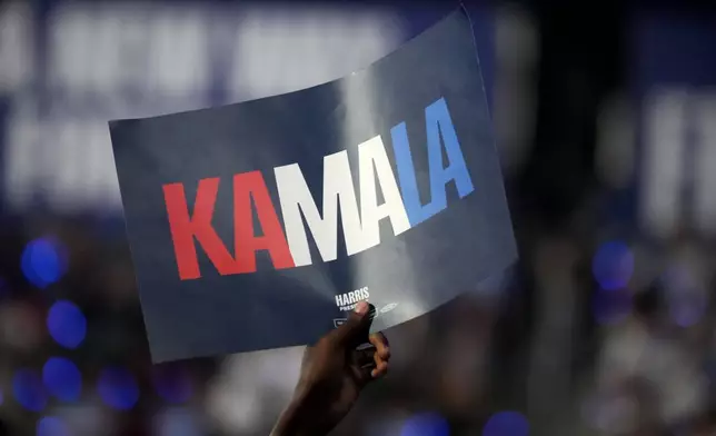 A supporter holds up a sign as Democratic presidential nominee Vice President Kamala Harris speaks during a campaign event, Thursday, Sept. 12, 2024, in Greensboro, N.C. (AP Photo/Chris Carlson)