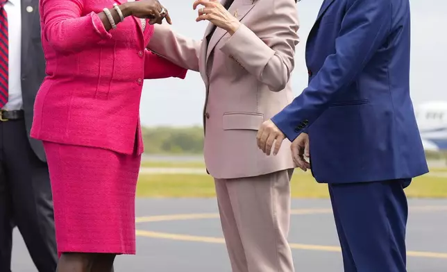 Democratic presidential nominee Vice President Kamala Harris, center, is greeted by Philadelphia Mayor Cherelle Lesley Parker, left, and Rep. Brendan Boyle, D-PA., right, on the tarmac at Atlantic Aviation Philadelphia, Monday, Sept. 9, 2024, near Philadelphia International Airport, in Philadelphia, Tuesday, Sept. 17, 2024. (AP Photo/Jacquelyn Martin)