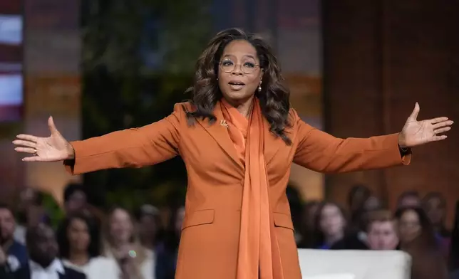 Oprah Winfrey speaks before Democratic presidential nominee Vice President Kamala Harris joins her at Oprah's Unite for America Live Streaming event Thursday, Sept. 19, 2024 in Farmington Hills, Mich. (AP Photo/Paul Sancya)