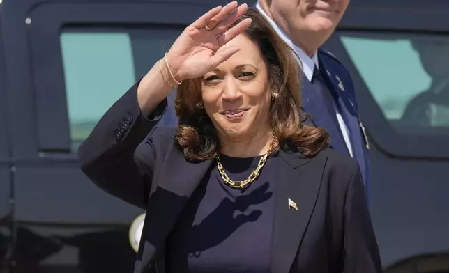 Democratic presidential nominee Vice President Kamala Harris waving to media members as she arrives at Pittsburgh International Airport, in Coraopolis, Pa., Thursday, Sept. 5, 2024, where she is expected to prepare for the first presidential debate. (AP Photo/Jacquelyn Martin)