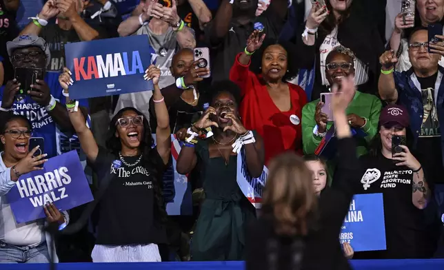 Supporters cheer as Democratic presidential nominee Vice President Kamala Harris waves during a campaign event, Thursday, Sept. 12, 2024, in Greensboro, N.C. (AP Photo/Matt Kelley)