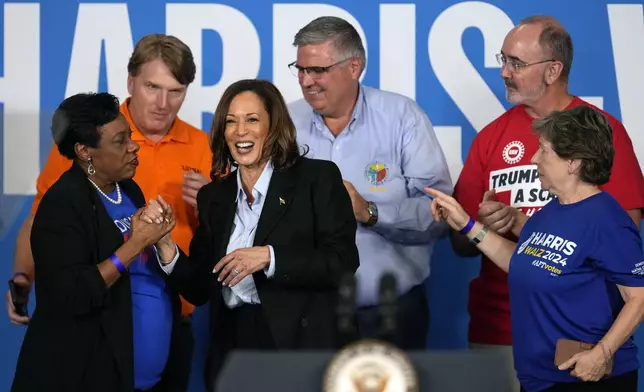 Democratic presidential nominee Vice President Kamala Harris greets labor leaders after speaking at a campaign event at Northwestern High School in Detroit, Monday, Sept. 2, 2024. (AP Photo/Paul Sancya)