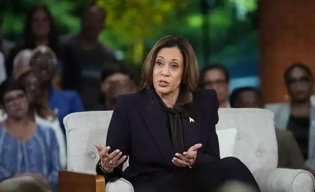 Democratic presidential nominee Vice President Kamala Harris answers an audience member's question as she joins Oprah Winfrey at Oprah's Unite for America Live Streaming event Thursday, Sept. 19, 2024 in Farmington Hills, Mich. (AP Photo/Paul Sancya)