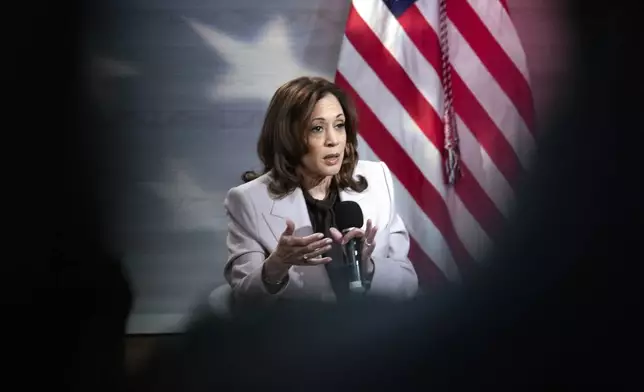 Democratic presidential nominee Vice President Kamala Harris Vice, seen on a handheld mobile phone, is interviewed by National Association of Black Journalists members Tonya Mosley, and Gerren Keith Gaynor, with moderator Eugene Daniels, at the WHYY studio in Philadelphia, Tuesday, Sept. 17, 2024. (AP Photo/Matt Rourke)