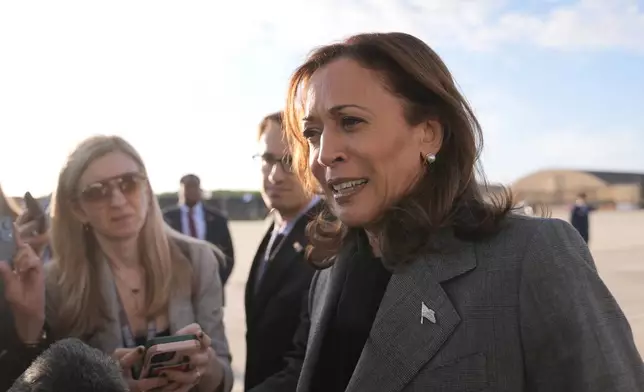 Democratic presidential nominee Vice President Kamala Harris speaks to members of the media upon her arrival at Andrews Air Force Base, Md., Sunday, Sept. 22, 2024. (AP Photo/Matt Rourke/Pool)