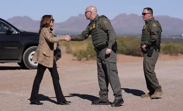Democratic presidential nominee Vice President Kamala Harris greets members of the U.S. Border Patrol as she visits the U.S. border with Mexico in Douglas, Ariz., Friday, Sept. 27, 2024. (AP Photo/Carolyn Kaster)
