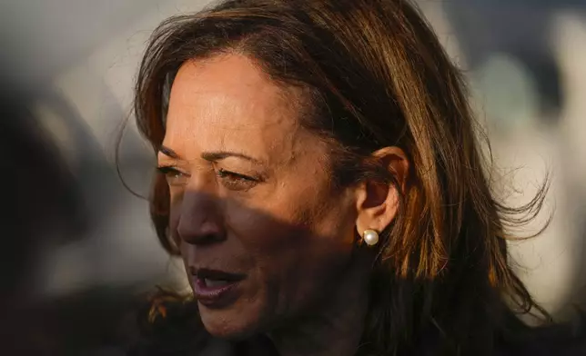 Democratic presidential nominee Vice President Kamala Harris speaks to members of the media upon her arrival at Andrews Air Force Base, Md., Sunday, Sept. 22, 2024. (AP Photo/Matt Rourke/Pool)