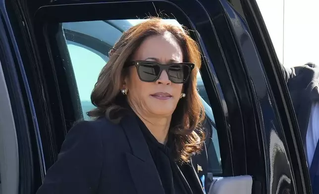 Democratic presidential nominee Vice President Kamala Harris steps out of her vehicle as she prepares to board Air Force Two at LaGuardia Airport in East Elmhurst, N.Y., Wednesday, Sept. 11, 2024. (AP Photo/Jacquelyn Martin)