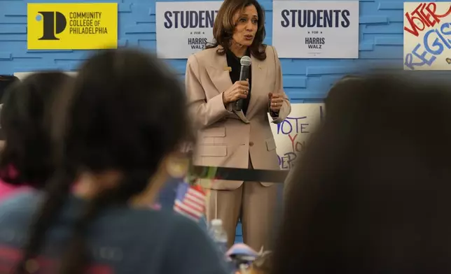 Democratic presidential nominee, Vice President Kamala Harris, center, speaking during an unscheduled stop to talk to student volunteers at Community College of Philadelphia, Tuesday, Sept. 17, 2024, in Philadelphia. (AP Photo/Jacquelyn Martin)