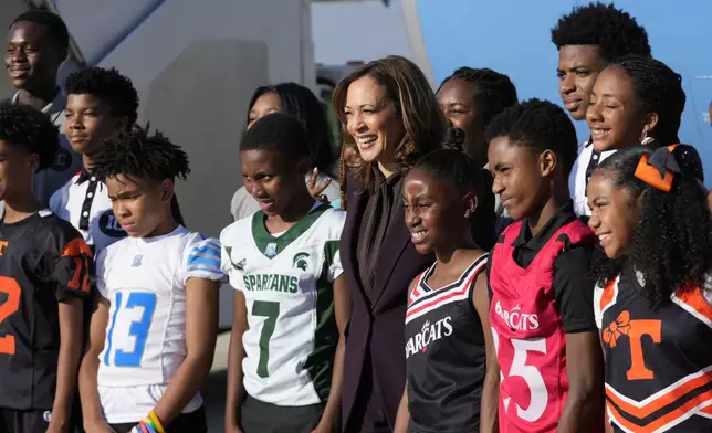 Democratic presidential nominee Vice President Kamala Harris, poses for a photograph upon her arrival at Detroit Metropolitan Airport in Romulus, Mich., enroute to join Oprah Winfrey at Oprah's Unite for America Live Streaming event Thursday, Sept. 19, 2024. (AP Photo/Paul Sancya)