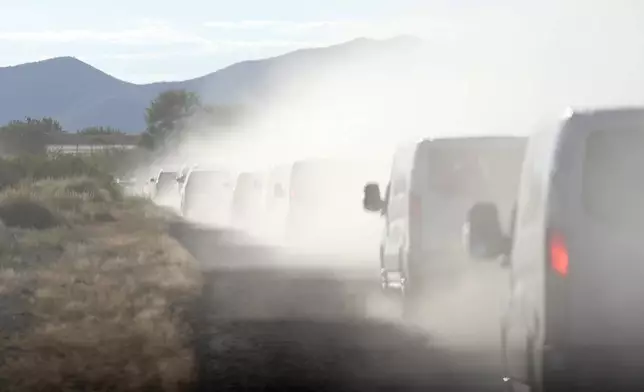 The motorcade with Democratic presidential nominee Vice President Kamala Harris drives away from the U.S. border with Mexico in Douglas, Ariz., Friday, Sept. 27, 2024. (AP Photo/Carolyn Kaster)