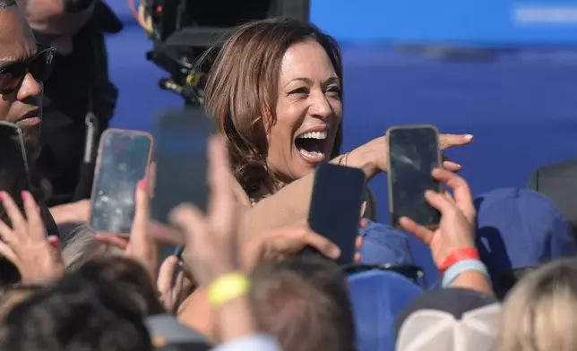 Democratic presidential nominee Vice President Kamala Harris greets people after speaking during a campaign stop at the Throwback Brewery, in North Hampton, N.H., Wednesday, Sept. 4, 2024. (AP Photo/Steven Senne)