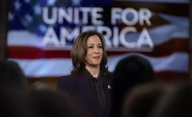 Democratic presidential nominee Vice President Kamala Harris listens as she joins Oprah Winfrey at Oprah's Unite for America Live Streaming event Thursday, Sept. 19, 2024 in Farmington Hills, Mich. (AP Photo/Paul Sancya)