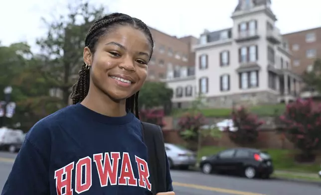 Howard University student Nikkya Taliaferro poses for a portrait across the street from her school, Friday, Aug. 30, 2024 in Washington. (AP Photo/John McDonnell)