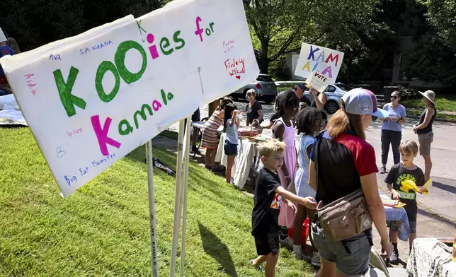 FILE - Kids hold a "Kookies for Kamala" cookie bake sale fundraiser for democratic presidential nominee Vice President Kamala Harris' campaign,Aug. 25, 2024, in Philadelphia. (Tom Gralish/The Philadelphia Inquirer via AP, File)