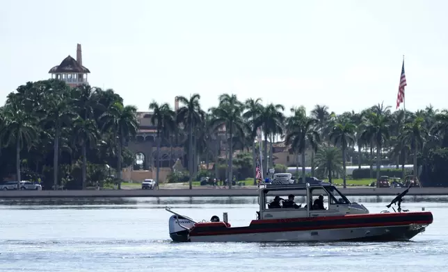 Law enforcement patrols in a boat outside of the Mar-a-Lago estate after the apparent assassination attempt of Republican presidential nominee and former President Donald Trump Monday, Sept. 16, 2024, in Palm Beach, Fla. (AP Photo/Lynne Sladky)