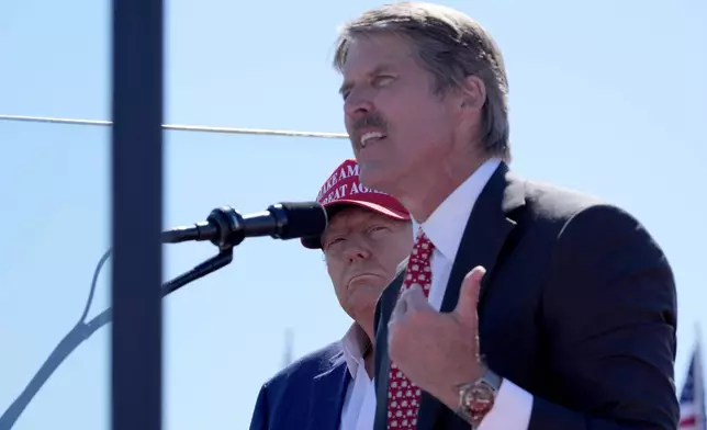 Republican presidential nominee former President Donald Trump, left, listens as Republican Senate candidate Eric Hovde speaks during a campaign event at Central Wisconsin Airport, Saturday, Sept. 7, 2024, in Mosinee, Wis. (AP Photo/Alex Brandon)