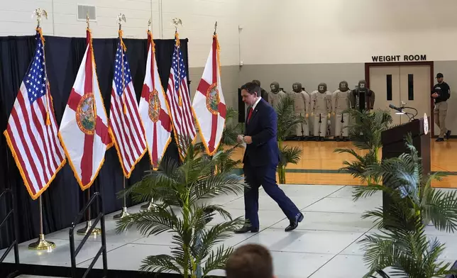 Florida Gov. Ron DeSantis walks from the podium after a news conference in the aftermath of the apparent assassination attempt of Republican presidential nominee and former President Donald Trump Tuesday, Sept. 17, 2024, in West Palm Beach, Fla. (AP Photo/Lynne Sladky)