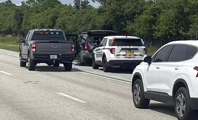 This photo provided by the Martin County Sheriff's Office shows Sheriff's vehicles surrounding an SUV on the northbound I-95 in Martin County on Sunday, Sept. 15, 2024. (Martin County Sheriff's Office via AP)